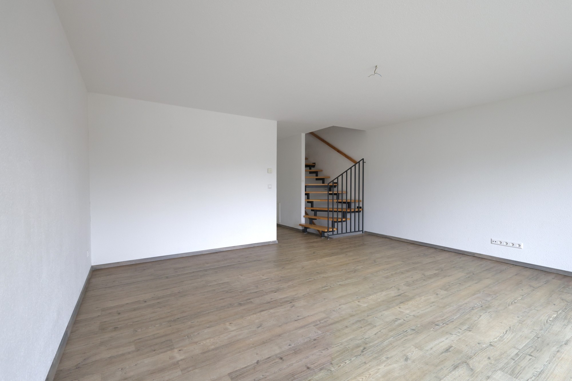 Wohnzimmer mit Treppenaufgang Wohnzimmer mit Treppenaufgang